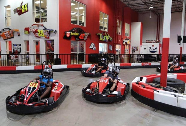kids drive at an indoor grand prix