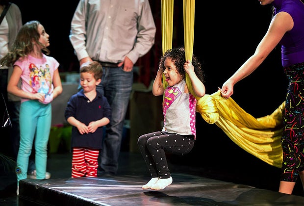 Girl on stage swinging