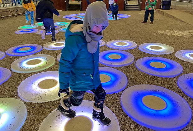 Little boy playing on The Pool at Industry City