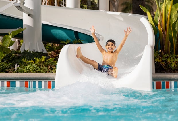 Boy slides down the Twister at Town and Country Resort. 