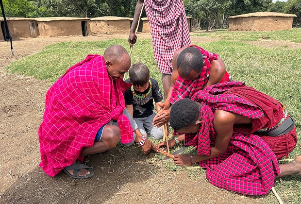 Planning a Perfect Family African Safari Vacation: making a fire with the locals 