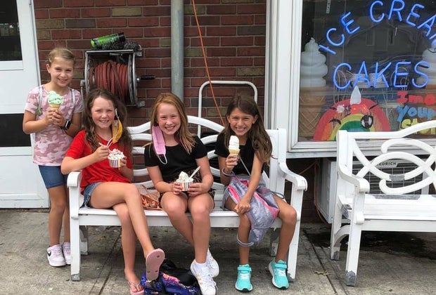 Kids enjoy ice cream cones in front of Verona's The Towne Scoope shop
