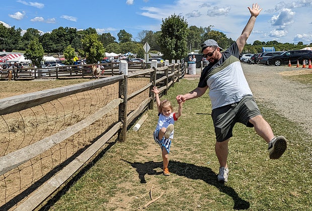 Visiting Alstede Farms with kids child and parent on the farm