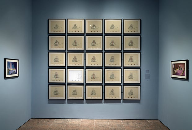 Cinderella sketches hung on a wall in Walt Disney exhibit at The Met
