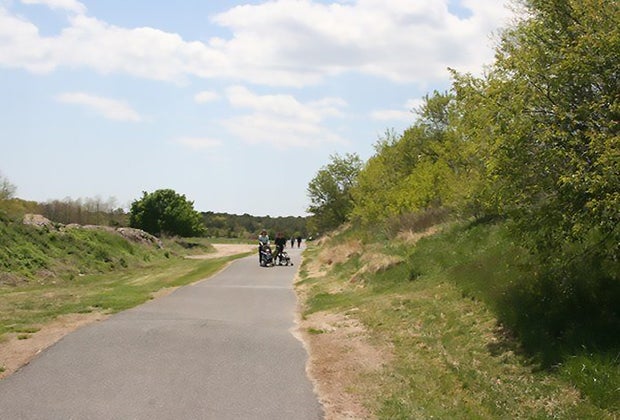 family on a path at Brookhaven Town's Ecology Site;