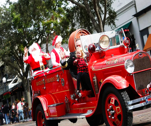 Santa rides through town at the Winter Park Parade! Photo courtesy of Visit Orlando