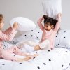 Did you know a pillow fight is a great way to get proprioceptive input? Photo by Mommy Poppins