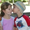 Two kids share a caramel apple. Photo by Meghan Rose