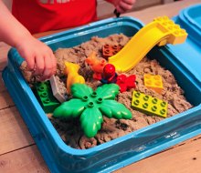 Lego plus sand means a fun sensory bin!