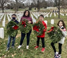 Place wreaths at the graves of fallen soldiers during the annual Wreaths Across America event. Photo courtesy of the author