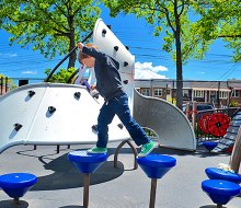 A top Queens playground, Paul Raimonda Playground offers sprinklers, climbing, and shady seating. Photo by author