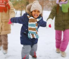 Playing in the snow is a favorite thing to do for kids in Boston during winter. Photo via Bigstock