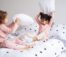 Did you know a pillow fight is a great way to get proprioceptive input? Photo by Mommy Poppins