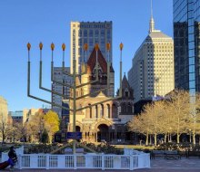 Head to Boston for affordable seasonal fun with the top free Christmas and holiday events for 2024! The menorah in Copley Square. Photo by Leslee/Flickr 2.0