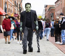 Get out and about to see some great Halloween events for free in 2024! Frankenstein on Essex Street in Salem, photo by Kate Fox.