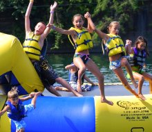 Bounce, splash, and make the most of summer at the best inflatable water parks in New England. Photo courtesy of Brownstone Adventure Sports Park