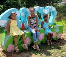 Take a photo at Tiny Doors ATL's door #6, featured in a custom bench by artist Ira Hill, located on the Beltline Eastside trail. Photo courtesy of Tiny Doors ATL