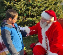 Santa Claus is coming to town, for breakfast, brunch, and photos with Santa in CT! Photo by Anne Ogden for the Mystick Chamber of Commerce.