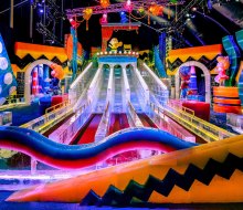 Tackle the slides at Ice! featuring A Charlie Brown Christmas. Photo courtesy of  Gaylord National Harbor