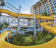 Twsit, turn, then plunge into refreshing waters with a wild ride down the water slide at Disney Paradise Piers Hotel. 
