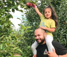 Get the kids in the car (and on your shoulders) for the best apple picking near Boston! Photo courtesy of Connors Farm 