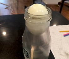 Watch as the egg slides into the bottle!