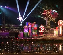 Santa Claus greets the trolley at Elf on the Shelf Magical Holiday Journey.
