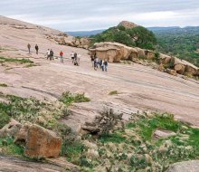 Make it an unforgettable family getaway from Houston  by hiking Enchanted Rock. Photo courtesy Passport to Texas.