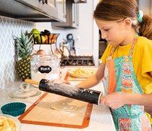 girl making apple pie courtesy of canva