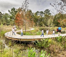 Kids walk a nature trail at the Houston Arboretum & Nature Center. Photo courtesy of the Houston Arboretum