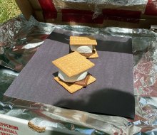This solar oven science experiment offers one tasty reward: ooey, gooey s'mores.