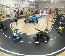 Kids can hop on tricycles and ride around the indoor track at L.I. Salty Kids Cove. 