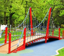 The climbing bridge at the LATCP playground at Eisenhower Park is a draw for kids of all ages. Photo courtesy of Let All The Children Play