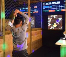 Experience the thrill of throwing an axe at a wooden target at Axe & Smash.