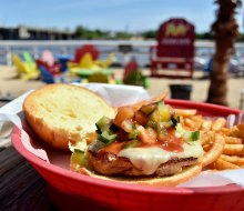 Enjoy the tropical island atmosphere and outdoor seating at Pop's Seafood Shack and Grill in Island Park.