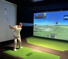  Golf simulators at X Golf in the Samanea Mall allow players to practice their swing. Photo by the author