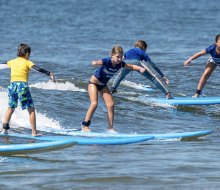 Learn to ride the waves with Skudin Surf in Long Beach. Photo by Jay Belsky