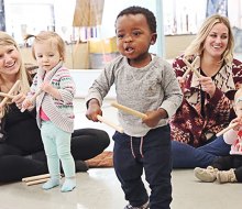 Caregivers and kids dance and sing at Music Together. Photo courtesy of Music Together