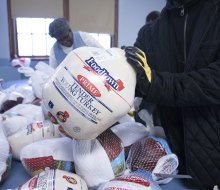 Many organizations throughout New York City are offering free turkey giveaways, plus full, hot Thanksgiving dinners this season. Photo by John McCarten for the New York City Council 