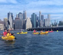 Kids can join parents to go kayaking in NYC at Brooklyn Bridge Park. Photo courtesy the Brooklyn Bridge Park Boathouse
