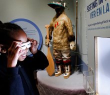 Try out snow goggles at the imagiNATIONS Activity Center at the National Museum of the American Indian. Photo by Jason DeCrow/AP Images for Smithsonian's National Museum of the American Indian