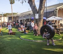 The Yardery offers a tire swing and yard games for the whole family to enjoy while parents savor a drink! Photo courtesy of the venue