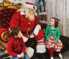 Kids can visit Santa and ride the carousel, Ferris wheel, and train at Christmas Village in Philadelphia. Photo courtesy of the event