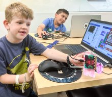 Hone their computer skills with the best coding classes for kids in Boston! Photo courtesy of Code Ninjas 