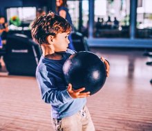 Little boy trying for a strike! Photo courtesy of Pinstripes