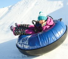 Snow tubing adventures in NorCal are at the ready for kids of all ages. Photo by Trevor Clark, courtesy of Tahoe Donner