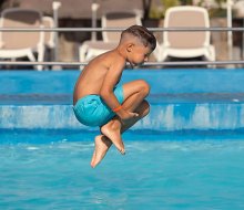 Cannonball! Make some fun summer memories at swimming pools and spray grounds around Boston this summer. Photo courtesy of the Waltham YMCA
