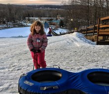Snow tubing is one of many fun winter activities to enjoy at the all-seasons Rocking Horse Ranch with kids. 