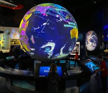 Our kids couldn't get enough of the interactive globe in the One World Connected exhibit. Photo by author Lisa Warden