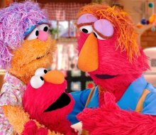 Elmo and his parents on Sesame Street. Image courtesy of PBS 